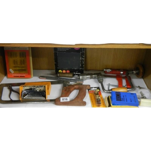 816 - A shelf of assorted tools.