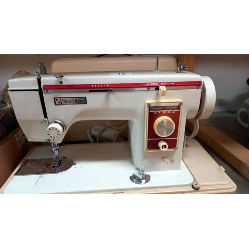 15 - A cased New Home sewing machine. COLLECT ONLY