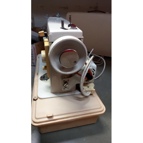 15 - A cased New Home sewing machine. COLLECT ONLY