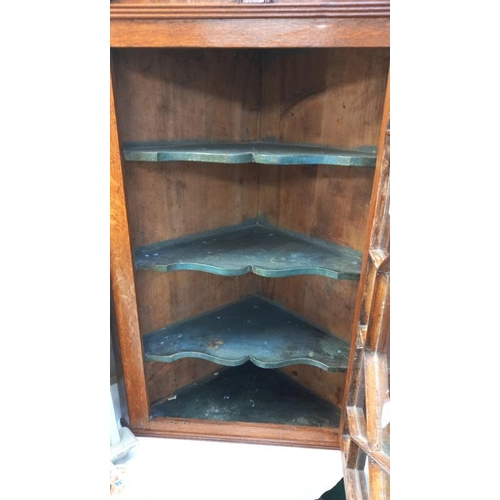 43 - A Victorian oak corner cupboard with astragal glazed door.  COLLECT ONLY