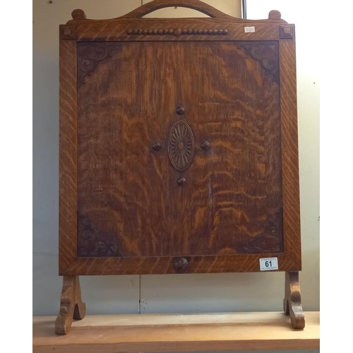 61 - A 1930's oak fire screen, 71cm x 51cm COLLECT ONLY