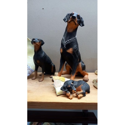 62 - A quantity of Doberman figures, 1 by Country Artists, 3 by Sherratt & Simpson, 1 unnamed, 2 by Borde... 