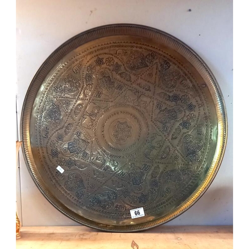 66 - A large brass tray - diameter 58cm