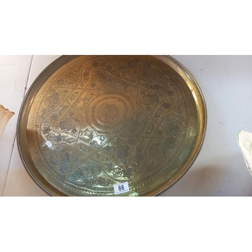 66 - A large brass tray - diameter 58cm