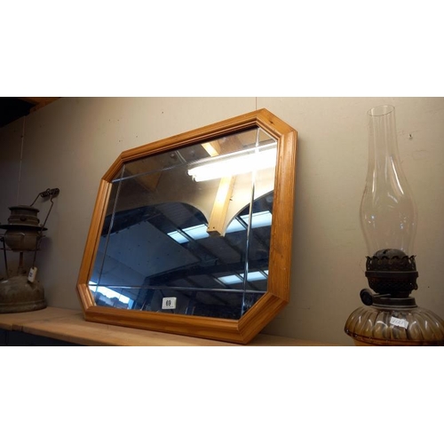 69 - A pine framed mirror - 68cm x 52cm. COLLECT ONLY