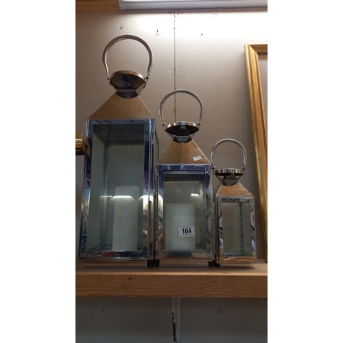 104 - A set of 3 graduated candle lanterns & a brass bankers lamp. COLLECT ONLY