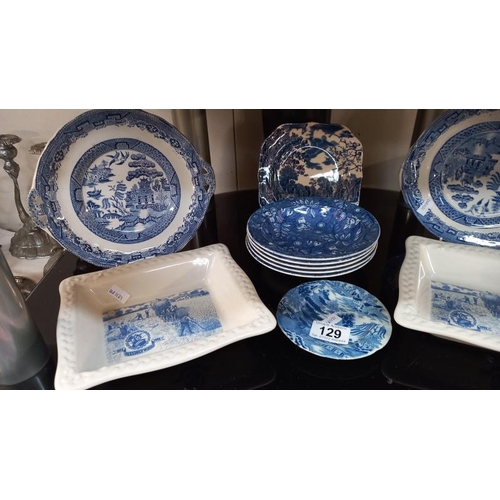 129 - A quantity of blue & white dishes/plates including 2 Shredded Wheat dishes