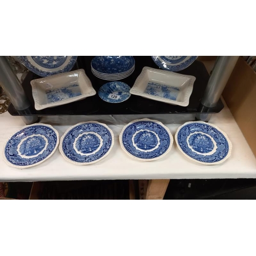 129 - A quantity of blue & white dishes/plates including 2 Shredded Wheat dishes