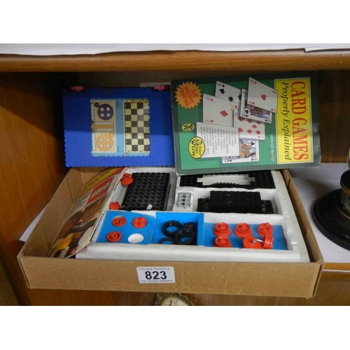 823 - A quantity of games including some lego.