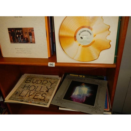 840 - Two shelves of LP records.