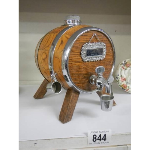 844 - A miniature oak whisky barrel.