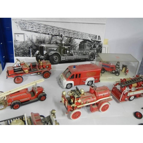 858 - A quantity of die cast fire engines.