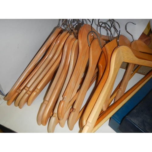 863 - A quantity of good wooden coat hangers.