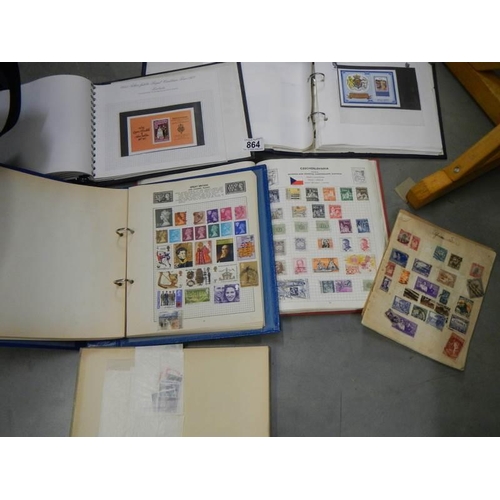 864 - A quantity of stamp albums with stamps.