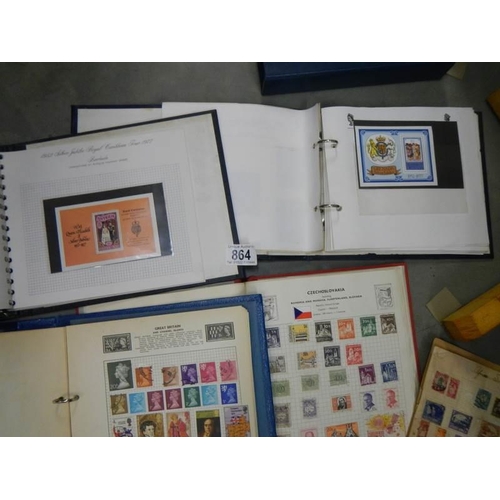 864 - A quantity of stamp albums with stamps.