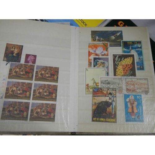 864 - A quantity of stamp albums with stamps.