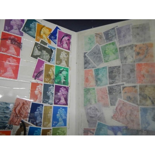 864 - A quantity of stamp albums with stamps.