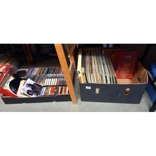 137 - A box of LP records and a box of singles, cd's and cassettes  COLLECT ONLY