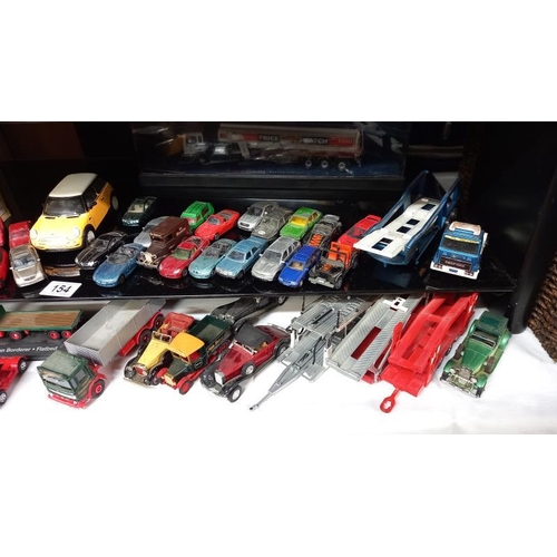 154 - A quantity of unboxed mixed diecasts including Corgi, Lledo etc