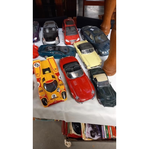 161 - A good collection of mainly 1/18 scale diecast model cars including Jaguar, MG etc