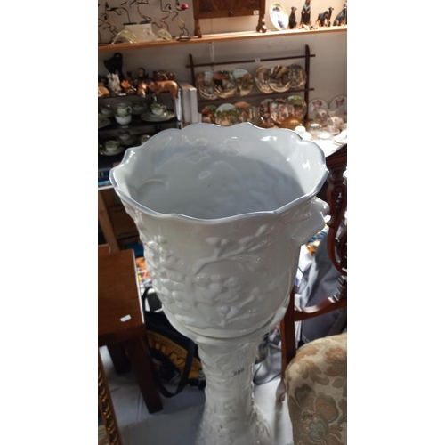 200 - A white glazed Jardiniere on stand height 85cm