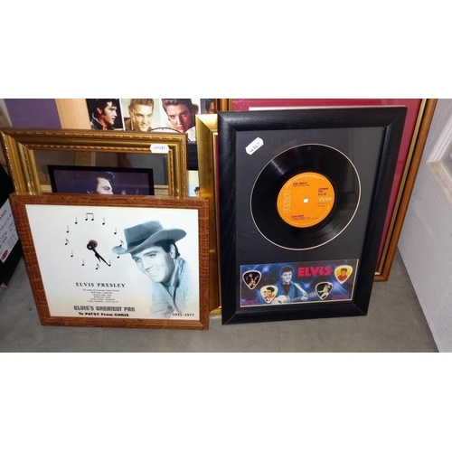 100A - A collection of Elvis Presley drawings, prints, clocks, montages & framed & glazed records etc.