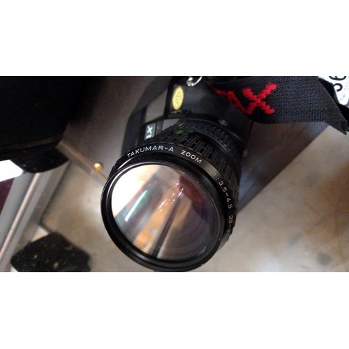 366 - A Pentax P30 camera with bag and a Riva Zoom 90C camera