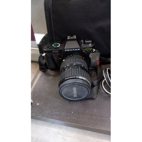 366 - A Pentax P30 camera with bag and a Riva Zoom 90C camera