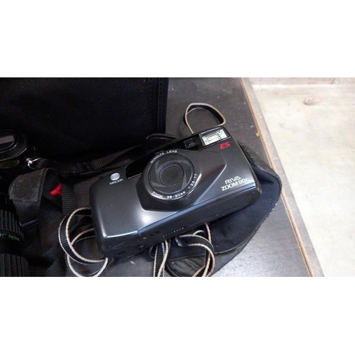 366 - A Pentax P30 camera with bag and a Riva Zoom 90C camera