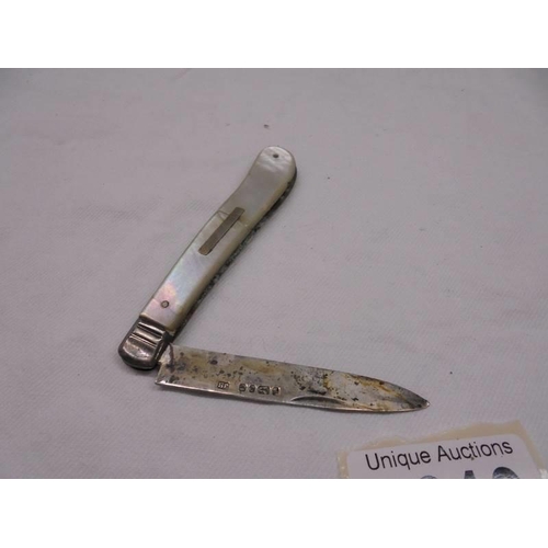 2010 - A silver vesta case engraved 'Dorothy' and an a/f silver and mother of pearl fruit knife.