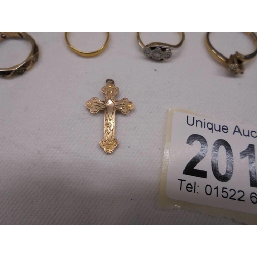 2013 - Four 9ct gold rings and a 9ct gold cross, 7.3 grams.