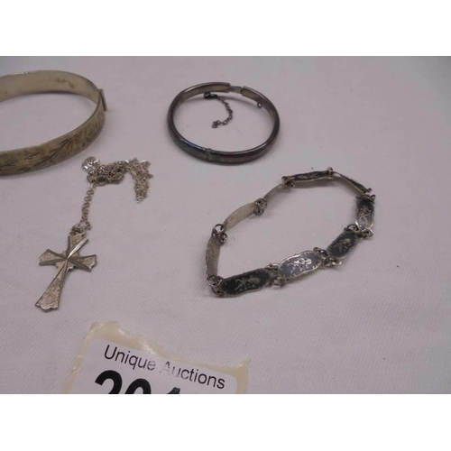 2016 - A silver bangle, a silver child's bangle, a silver bracelet and a silver cross on chain.