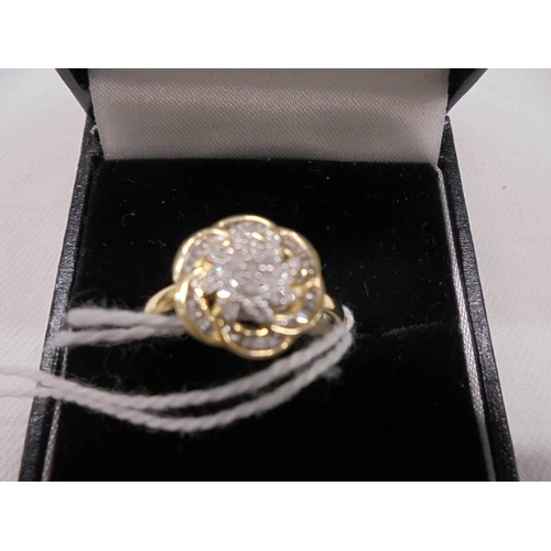 2021 - An all over diamond swirl ring in white/yellow gold, size P. 2.1 grams.