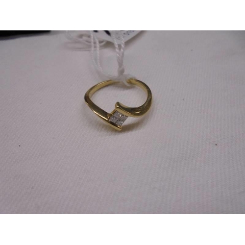 2030 - A stylish four stone 18ct gold designer ring, size M half, 2.7 grams.