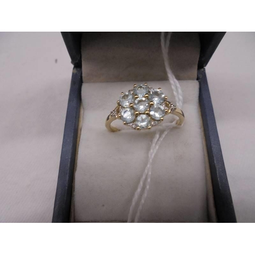 2031 - A 9ct yellow gold topaz and diamond ring, size R, 2 grams.