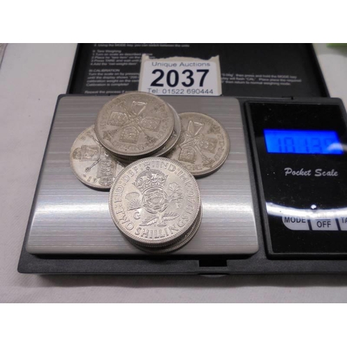 2037 - Nine silver florins, approximately 100 grams.