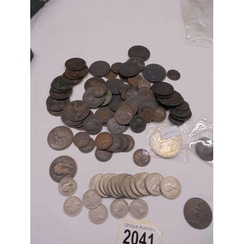 2041 - A mixed lot of copper coins etc., including Birmingham half penny.