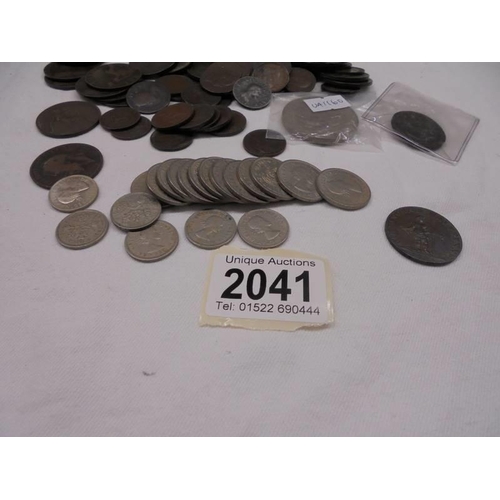 2041 - A mixed lot of copper coins etc., including Birmingham half penny.