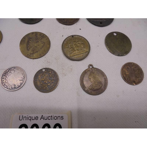 2060 - A mixed lot of early coins and tokens including Victoria, George III etc.,