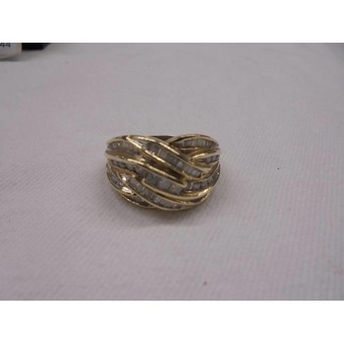 2064 - A 9ct gold ring set baguette diamonds, size P, 6 grams total.