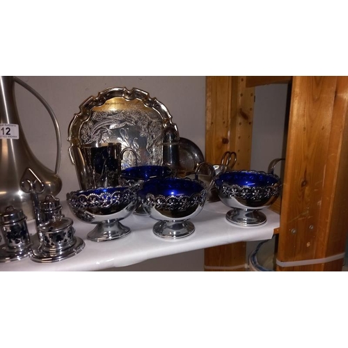 12 - A Selection of Chrome and Sliver Plated Metal Wear including Blue Glass Lined Cruet Set