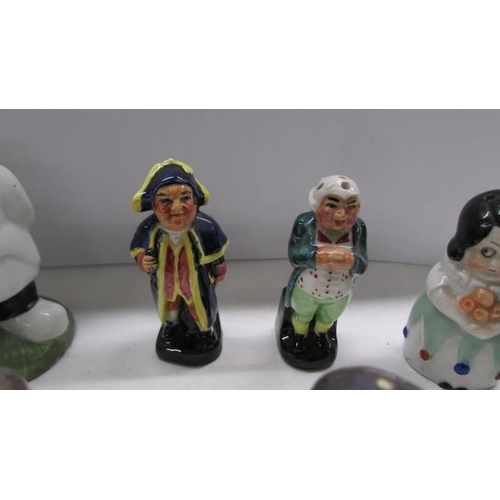 Four pairs of novelty salt and pepper pots.