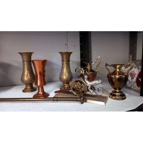 100 - A selection of copper and brass including jugs, letter rack, hunting horn etc.,