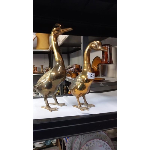 122 - A pair of solid brass duck ornaments