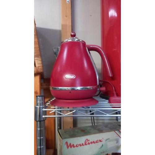 131 - A Red kitchen waste bin storage container, kettle and storage canisters.