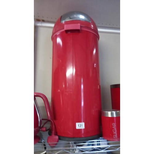 131 - A Red kitchen waste bin storage container, kettle and storage canisters.