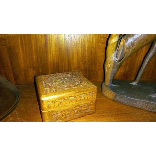 194 - A carved wooden African Ibix? & a box