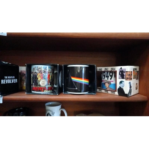 200 - A good selection of collectable mugs