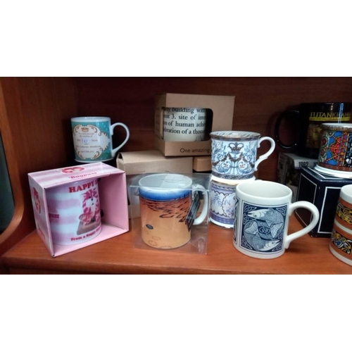 200 - A good selection of collectable mugs