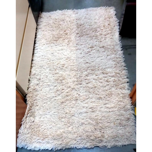 203 - A cream rug